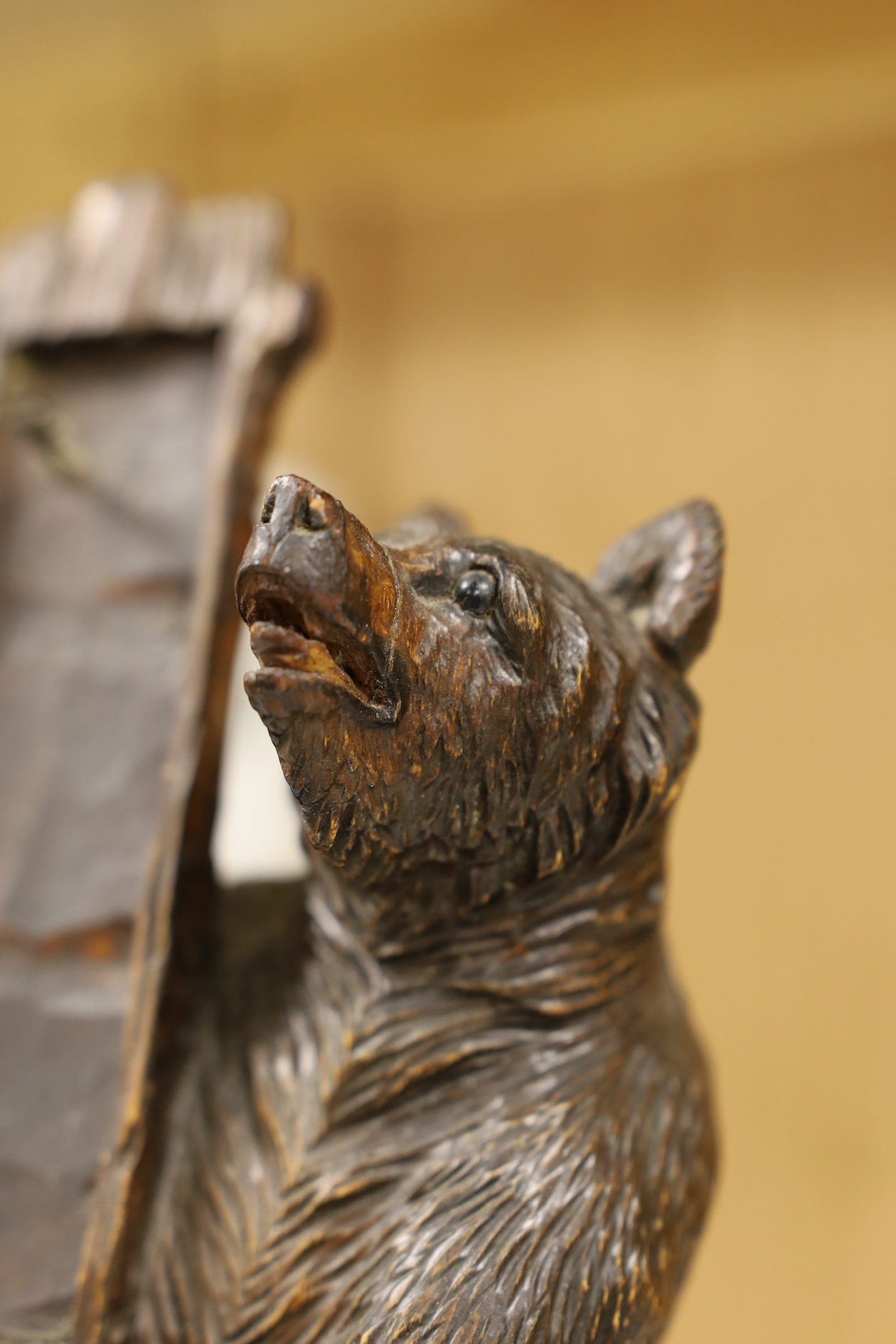 A Black Forest bear stand, 23cm high. Condition - fair needs re waxing